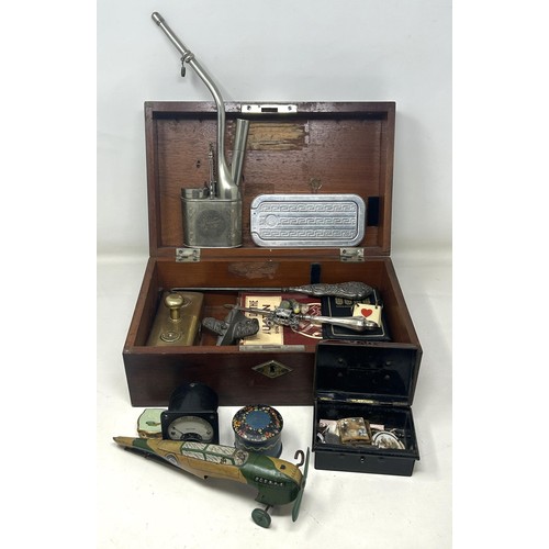 1034 - A Chinese silver plated pipe, and other items, in a mahogany box
