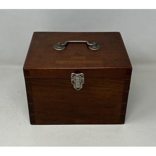 1036 - An AA car badge and other items, in a mahogany box