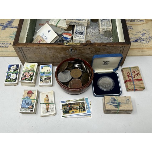 1037 - Assorted coins and cigarette cards, in a rosewood box