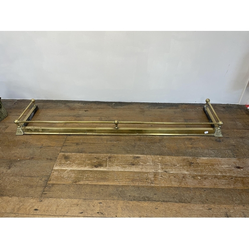 1292 - A brass adjustable fender and a standard lamp (2)