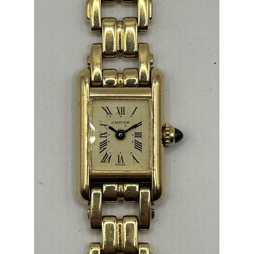 829 - A ladies 18ct gold Cartier Tank Quartz wristwatch, with cabochon winder, 42 g (all in)