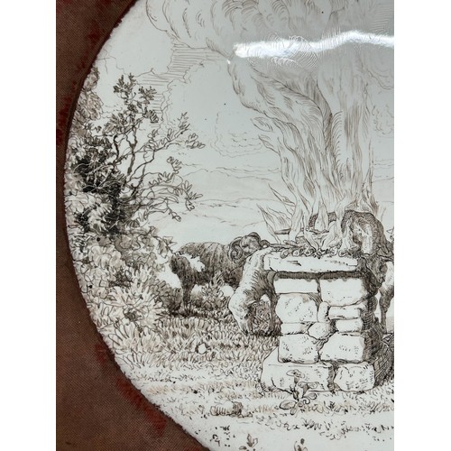1012 - A late 19th century oval pottery plaque, decorated figures and animals by fires, signed Violet Littl... 