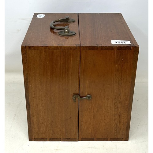 1144 - An early 20th century mahogany travelling tantalus, with four original bottles, and twelve non match... 