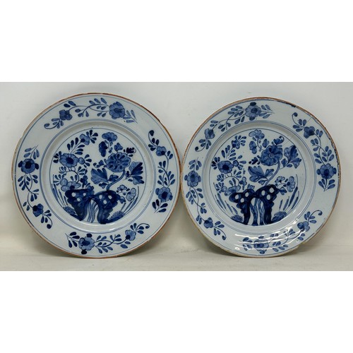 1155 - A pair of Dutch Delft blue and white plates, 23 cm wide (2)