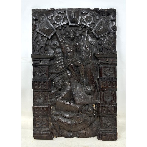 1156 - An oak panel, carved a religious scene, 35 x 23 cm