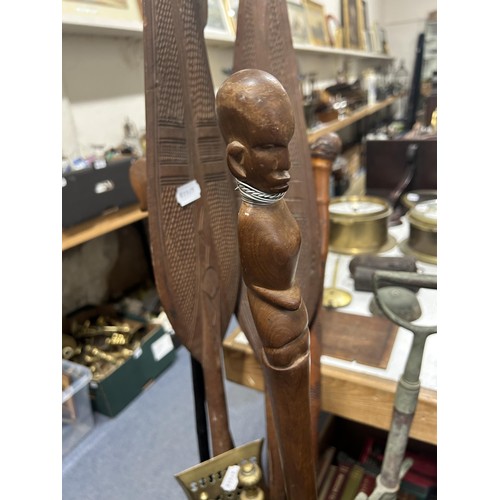 1001 - A stick stand, an African carved wood leaf paddle, and other items
