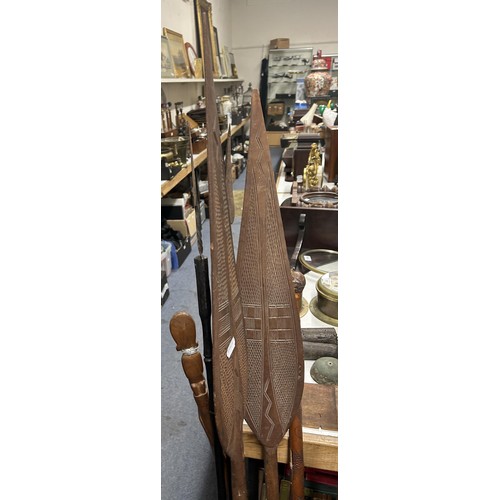 1001 - A stick stand, an African carved wood leaf paddle, and other items