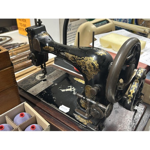 980 - A vintage The Fox hairpin box, assorted buckles, other sewing items and a sewing machine (qty)