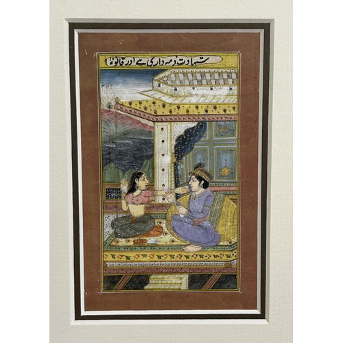 1152 - Persian school, two figures seated, with script, watercolour on paper, 11 x 7 cm