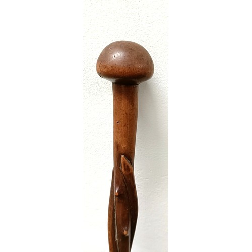 1110 - A folk art carved wooden walking stick, in the form of a twisted branch, 87 cm Provenance: Part of a... 