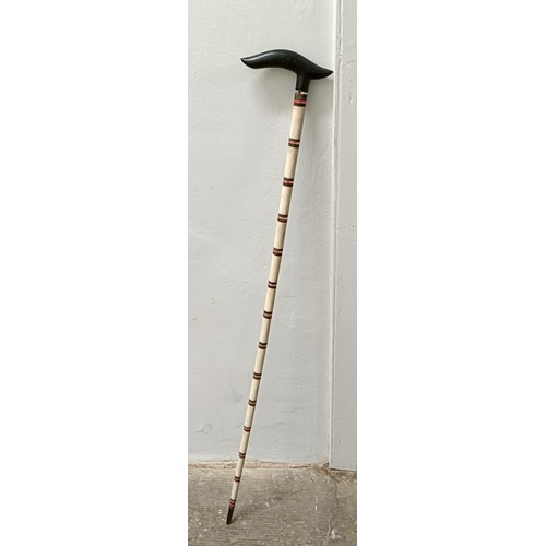 1114 - An Anglo Indian ebony, bone and ruby glass walking stick, 93 cm Provenance: Part of a single owner c... 