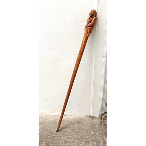 1123 - A novelty walking stick, handle carved in the form of a monkey, 94 cm Provenance: Part of a single o... 