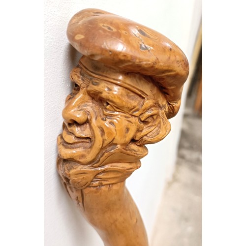 1127 - A folk art walking stick, handle carved in the form of a man wearing a hat, 90 cm Provenance: Part o... 