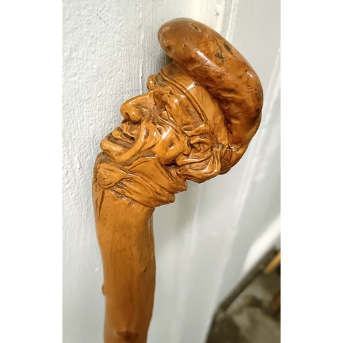 1127 - A folk art walking stick, handle carved in the form of a man wearing a hat, 90 cm Provenance: Part o... 