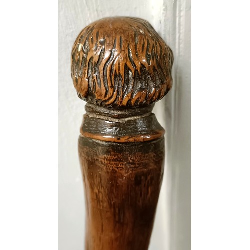 1128 - A folk art walking stick, handle carved in the form of a man's head, 92 cm Provenance: Part of a sin... 