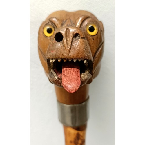 1133 - An early 20th century novelty walking stick, handle carved in the form of a bulldog, with a silver p... 