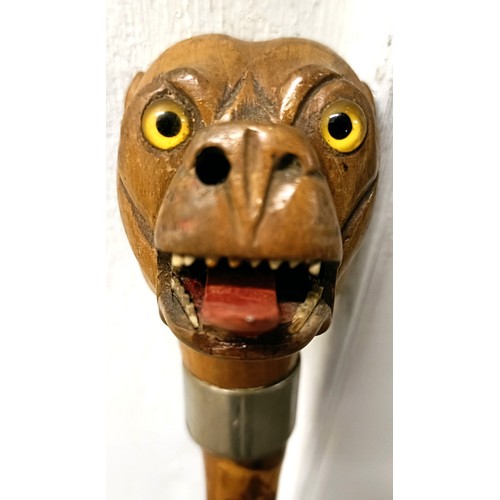 1133 - An early 20th century novelty walking stick, handle carved in the form of a bulldog, with a silver p... 