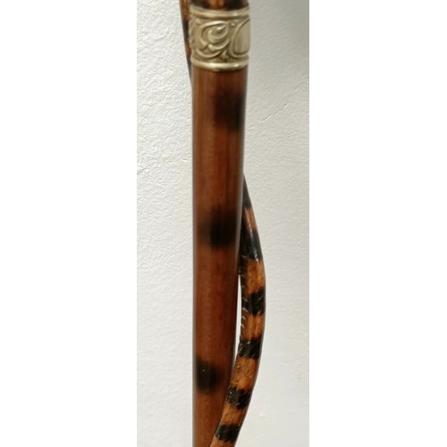 1138 - An early 20th century, novelty walking stick, with a carved bamboo handle decorated animals, inset w... 