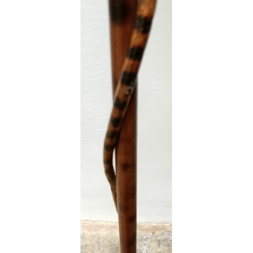 1138 - An early 20th century, novelty walking stick, with a carved bamboo handle decorated animals, inset w... 