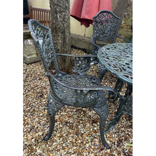 1296 - A painted metal garden table, four matching chairs and a parasol