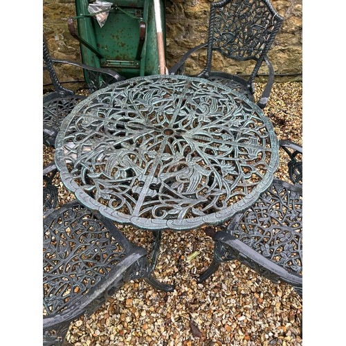 1296 - A painted metal garden table, four matching chairs and a parasol