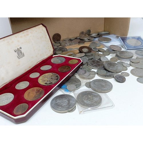 265 - Two crowns, 1935, six Victorian half crowns, a Coronation coin set, 1953, crown down, boxed, and oth... 