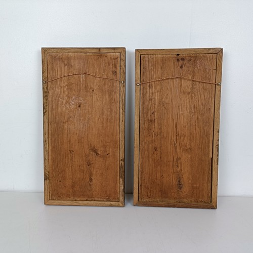 1005 - A pair of carved oak panels, decorated dead game, 48 x 25 cm (2)
