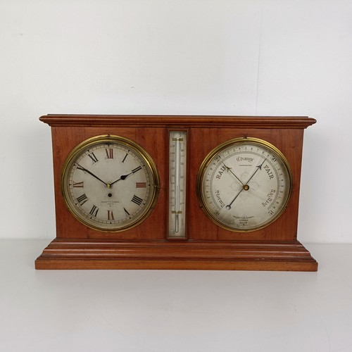 873 - A large desk clock/barometer by Negretti and Zambra, London No 290205, with dual silvered dials and ... 