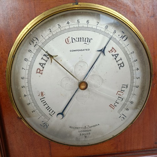 873 - A large desk clock/barometer by Negretti and Zambra, London No 290205, with dual silvered dials and ... 