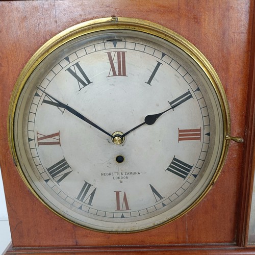 873 - A large desk clock/barometer by Negretti and Zambra, London No 290205, with dual silvered dials and ... 