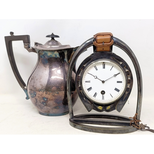 874 - A novelty silver plated mantel clock, in the form of a stirrup and a horseshoe, with a single train ... 