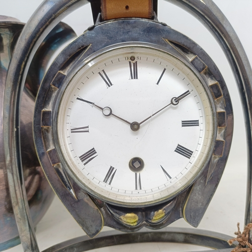 874 - A novelty silver plated mantel clock, in the form of a stirrup and a horseshoe, with a single train ... 