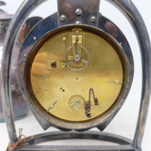 874 - A novelty silver plated mantel clock, in the form of a stirrup and a horseshoe, with a single train ... 