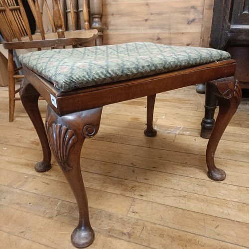 1310 - A mahogany footstool, with an embroidered drop in seat