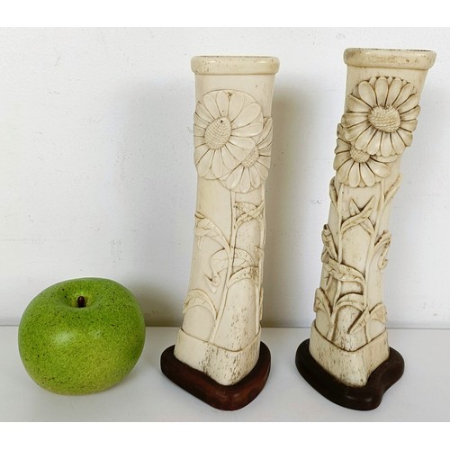 847 - Trench Art: A pair of vases made from bones, carved flowers and foliage, on wooden stands, 20.5 cm h... 