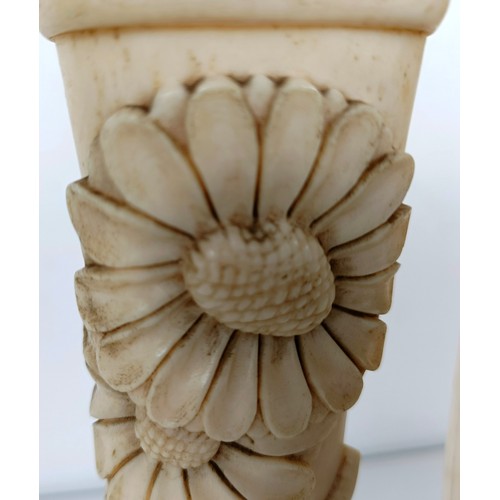 847 - Trench Art: A pair of vases made from bones, carved flowers and foliage, on wooden stands, 20.5 cm h... 