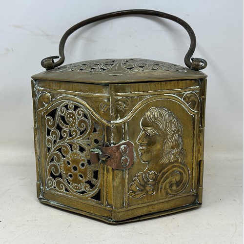 810 - An unusual brass hexagonal warmer, pierced flowers and foliage, and embossed panels of bust portrait... 