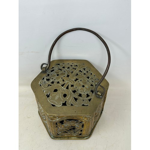 810 - An unusual brass hexagonal warmer, pierced flowers and foliage, and embossed panels of bust portrait... 