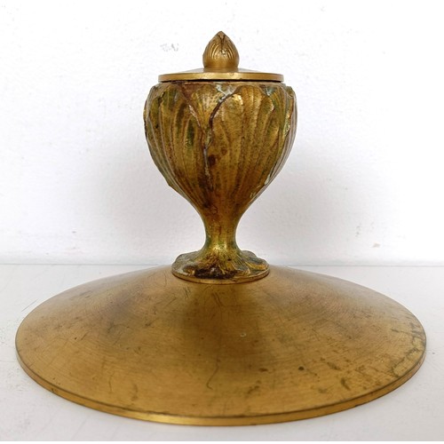 834 - A gilt brass inkwell, 14 cm diameter