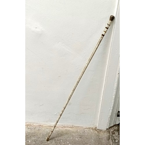 758 - A late 19th/early 20th century fish vertebrae walking stick, 88 cm Provenance: Part of a single owne... 