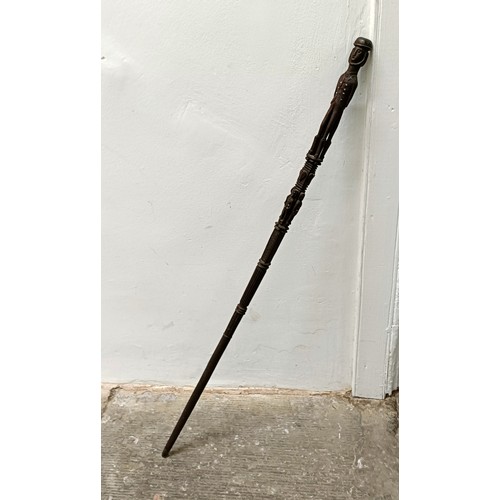 770 - A good folk art walking stick, handle carved in the form of two bearded men, 84 cm Provenance: Part ... 