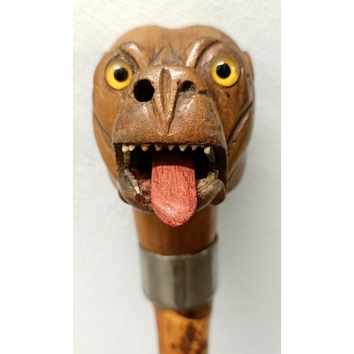 771 - An early 20th century novelty walking stick, handle carved in the form of a bulldog, with a silver p... 