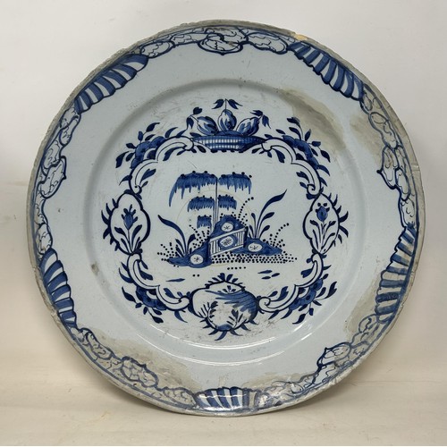 719 - A pair of Delft vases, 33 cm high, and a Delft plate, 37 cm high (3)