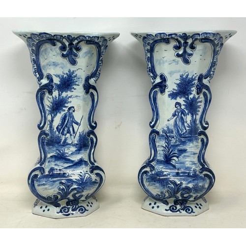 719 - A pair of Delft vases, 33 cm high, and a Delft plate, 37 cm high (3)