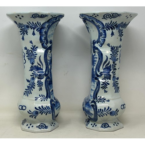 719 - A pair of Delft vases, 33 cm high, and a Delft plate, 37 cm high (3)