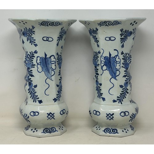 719 - A pair of Delft vases, 33 cm high, and a Delft plate, 37 cm high (3)