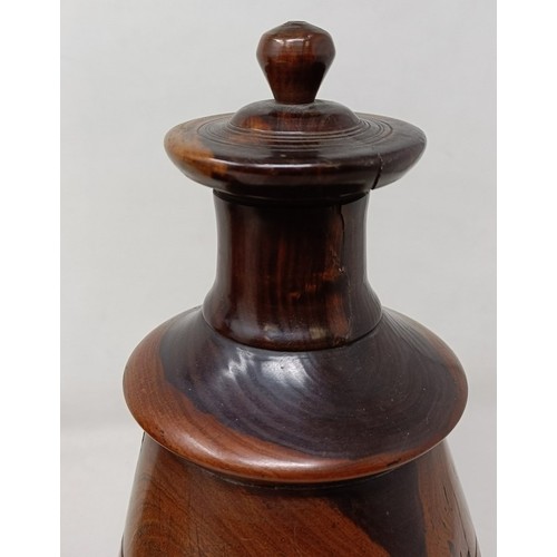 717 - A pair of turned lignum vitae urns and cover, 30 cm high (2)