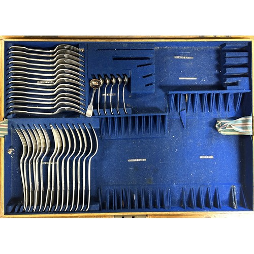 819 - A canteen of cutlery, in an oak case, with a four piece tea service