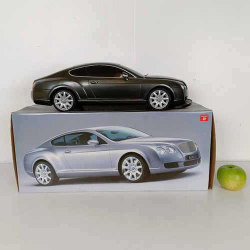 59 - A radio controlled Bentley Continental GT car, a similar Lamborghini, Jaguar calendars and posters (... 