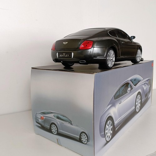 59 - A radio controlled Bentley Continental GT car, a similar Lamborghini, Jaguar calendars and posters (... 